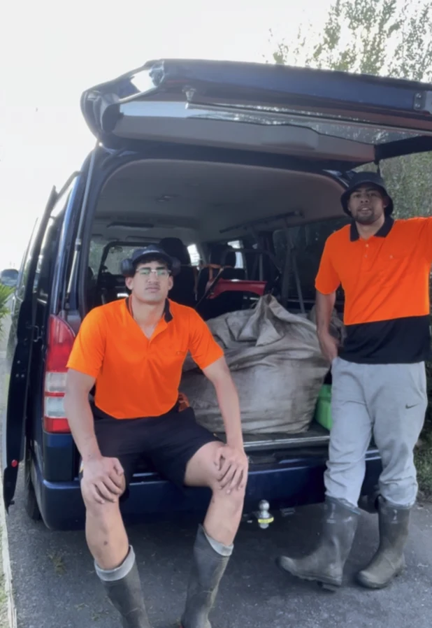 The YoungBucks Garden Care team beside a van loaded with gardening gear