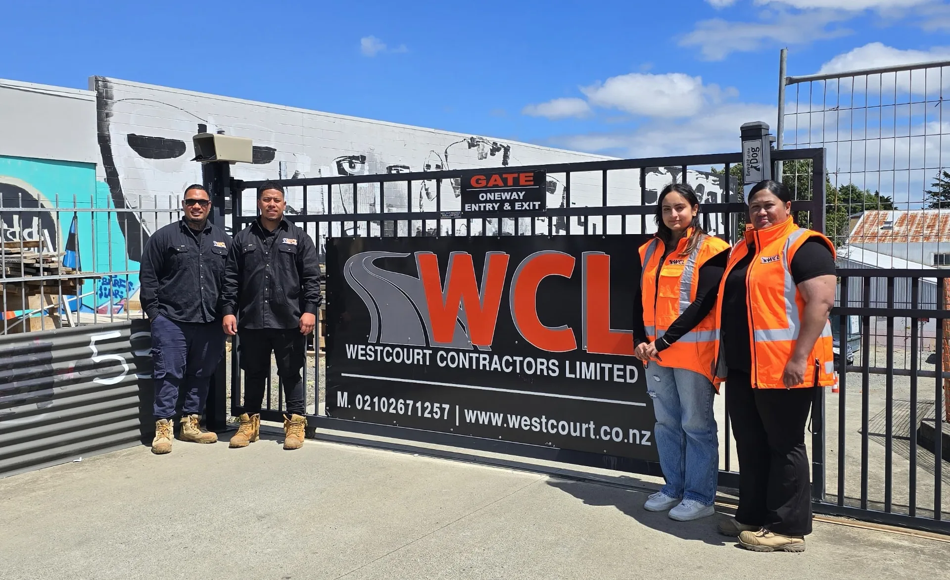 The Westcourt Contractors team standing at the WCL gate in Auckland